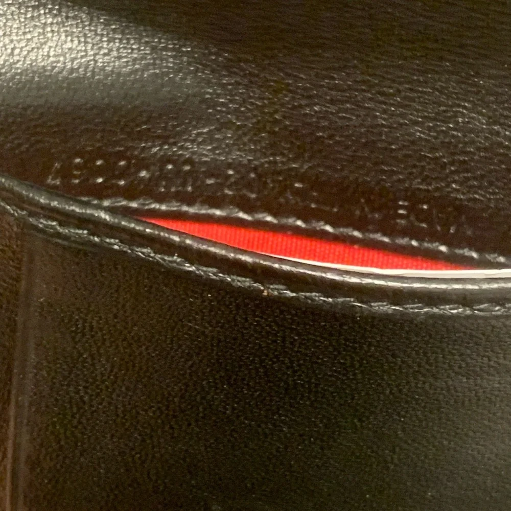 Black leather Christian Dior compact wallet